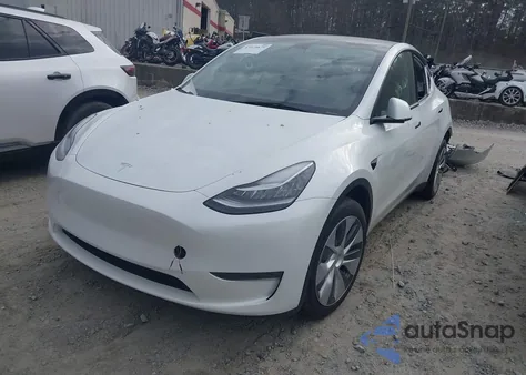 2023 Tesla Model Y Awd/Long Range Dual Motor All-Wheel Drive z USA, uszkodzony, nr VIN 7SAYGDEE1PA117401